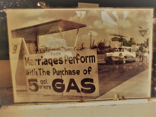 Marriage Ceremony with Gas Purchase Sign